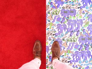 man standing on two different floors - one with a solid background - one with a patterend background